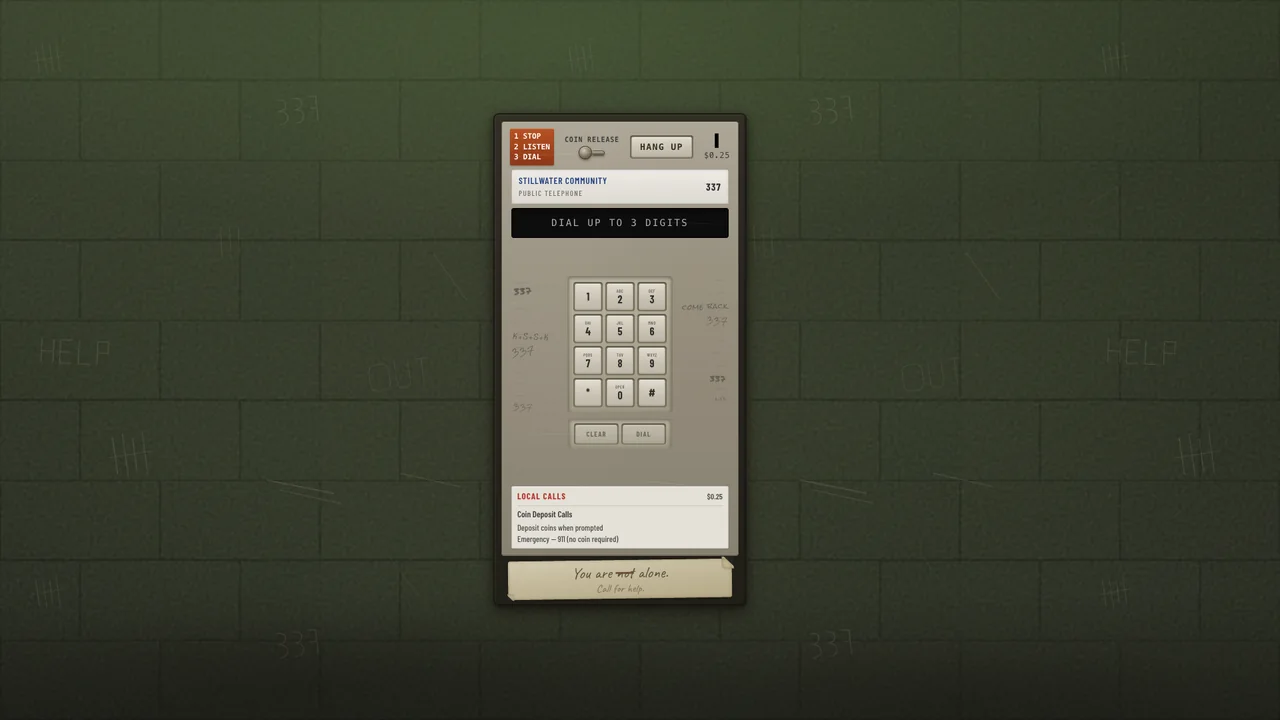 A payphone mounted on a wall in a dim corridor.